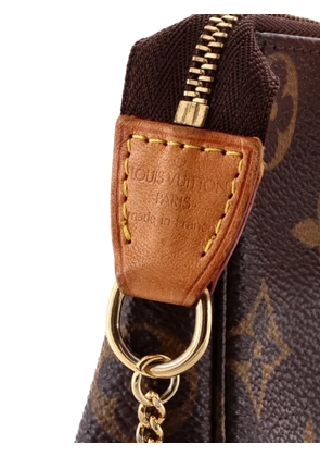Louis Vuitton Pre-Owned Pochette Accessoires Monogram Canvas Mini clutch bag - Brown