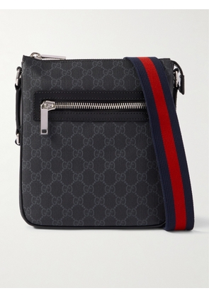Gucci - GG Leather-Trimmed Monogrammed Supreme Coated-Canvas Messenger Bag - Men - Black