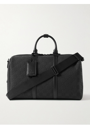 Gucci - Edge Leather-Trimmed Monogrammed Rubber Duffle Bag - Men - Black