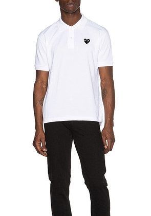 COMME des GARCONS PLAY Cotton Polo with Black Emblem in White - White. Size M (also in S).