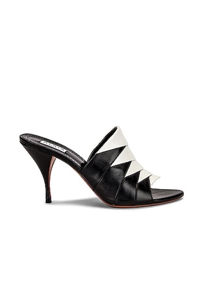 ALAÏA Leather Mules in Noir & Blanc - Black. Size 36.5 (also in 38.5).