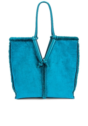 Bottega Veneta Shearling Reversible Bag in Blaster & Silver - Teal. Size all.