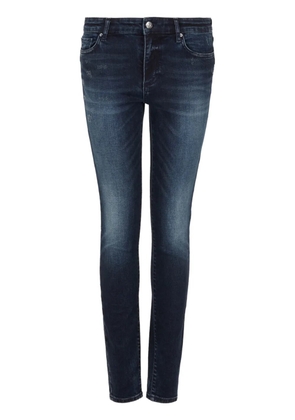 Armani Exchange logo-appliqué whiskering-effect skinny-cut jeans - Blue