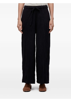 Osklen wrinkle-effect trousers - Black