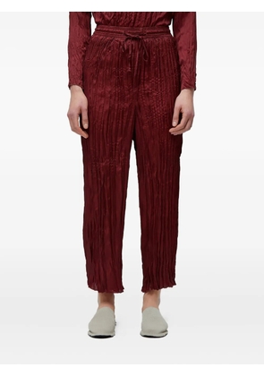 Osklen wrinkled-effect satin trousers - Red