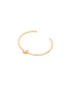 BaubleBar Ties Cuff Bracelet in Metallic Gold.