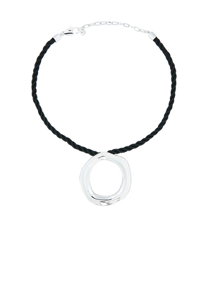 Ettika Open Circle Silk Necklace in Metallic Silver.