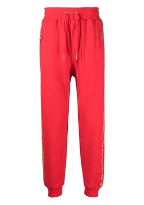 Ksubi slogan-embroidered track pants