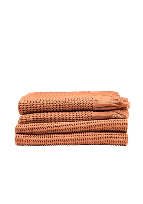 House No. 23 Ella Waffle Towel in Burnt Orange.