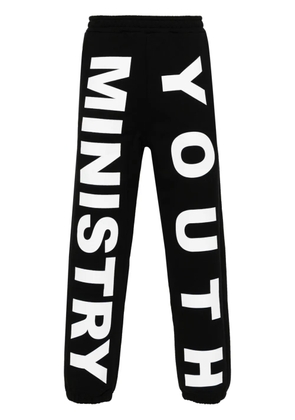 Liberal Youth Ministry logo-print cotton track pants - Black
