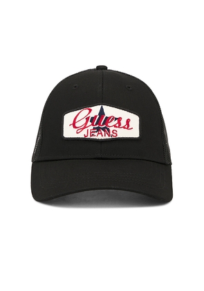 Guess Jeans Patched Trucker Hat in Black.