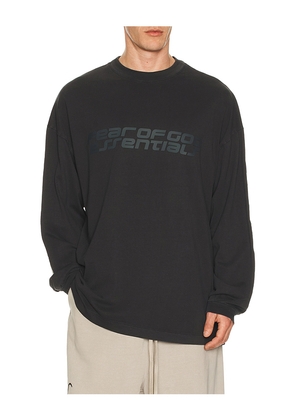 Fear of God ESSENTIALS 90'S Long Sleeve Tee in Black. Size L. Also in XS, S, M, XL/1X, XXL/2X.