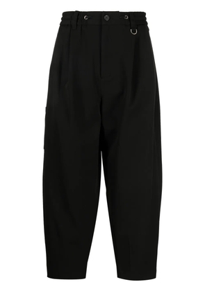 SONGZIO logo-embroidered pleated drop-crotch trousers - Black