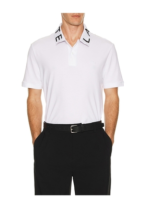 Lacoste Slim Fit Polo in White. Size 5. Also in 6.