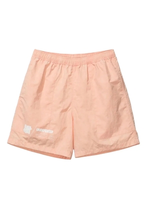 Undefeated logo-print tie-dye shorts - Orange