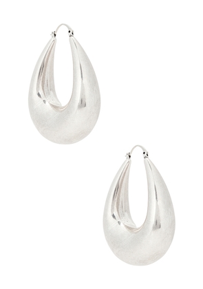 SHASHI Julia Silver Hoop Earring in Metallic Silver.