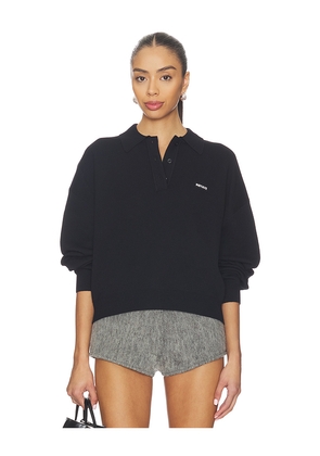 ROTATE Slinky Knit Polo in Black. Size L. Also in M, S, XS.