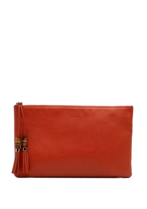 Gucci Pre-Owned 2016-2025 Calfskin Bamboo Tassel clutch bag - Orange