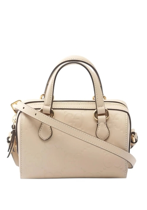 Gucci Pre-Owned 2010s embossed-GG handbag - Neutrals