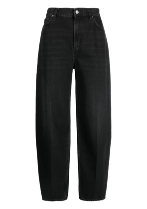 TOTEME faded-effect tapered-leg jeans - Black