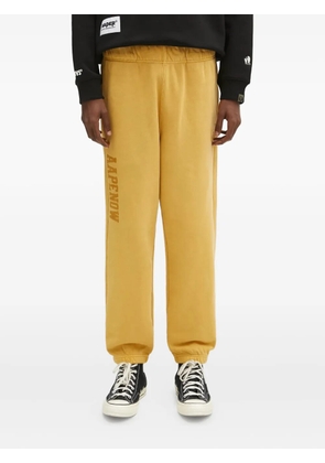 AAPE BY *A BATHING APE® Aape Now-logo track pants - Yellow