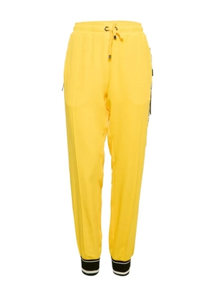 Dolce & Gabbana Pre-Owned logo-tape crepe track pants - Yellow
