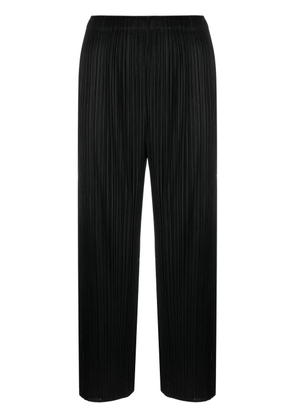 Pleats Please Issey Miyake cropped pleated trousers - Black