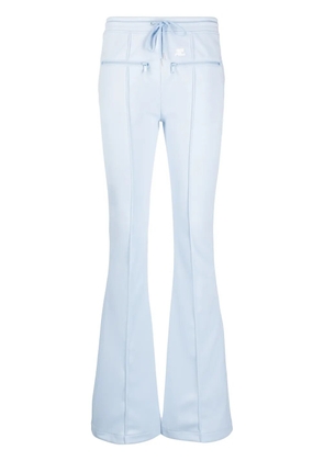 Courrèges seam-detailing flared track pants - Blue