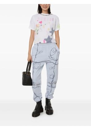 Collina Strada rose-print embellished track pants - Blue