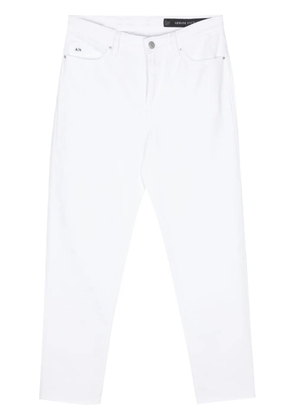 Armani Exchange logo-embroidered tapered jeans - White