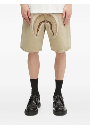 A BATHING APE® garment-dyed denim shorts - Neutrals