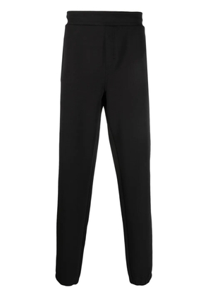 Calvin Klein logo-debossed track pants - Black