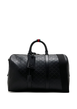 Gucci mediumGG Emblem leather duffle bag - Black