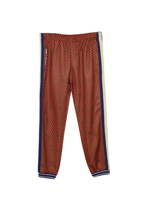 Gucci Pre-Owned diagonal-stripe track pants - Red