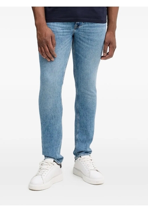 GUESS USA Finnley logo patch jeans - Blue