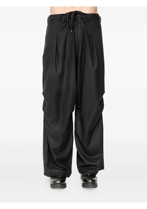 Andrea Ya'aqov drawstring-waist pleated trousers - Black