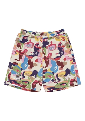 A BATHING APE® x KIDSUPER camouflage-print track shorts - Red