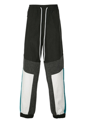 God's Masterful Children geometric panelled track pants - Black