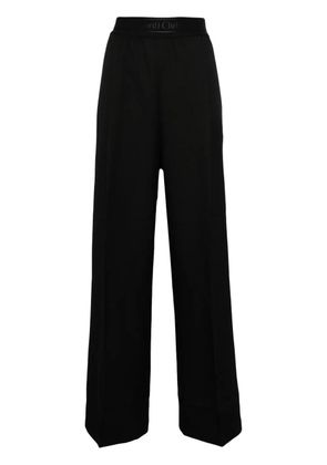 Stockholm Surfboard Club logo-waistband trousers - Black