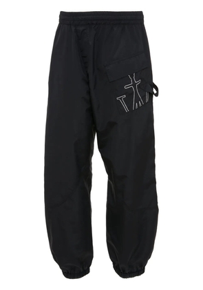 JW Anderson Anchor-embroidered twisted track pants - Black