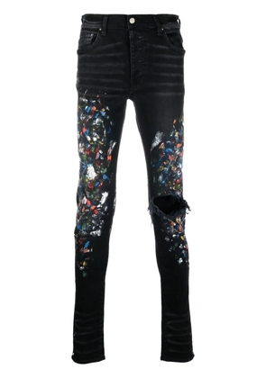 AMIRI paint print distressed skinny jeans - Black