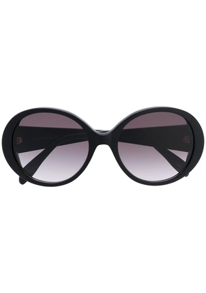 Alexander McQueen Eyewear round frame oversized sunglasses with gold logo lettering - Black