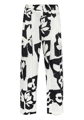 Issey Miyake abstract-print trousers - White