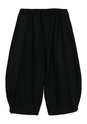 Black Comme Des Garçons cropped tapered trousers