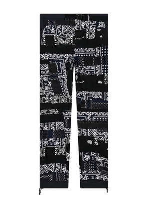 sacai x Hank Willis Thomas patchwork trousers - Black