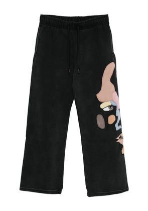 KidSuper motif-appliqué trousers - Black