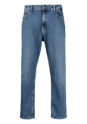 Calvin Klein logo-patch mid-rise tapered jeans - Blue