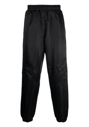 Études Studio Tour satin-finish trousers - Black