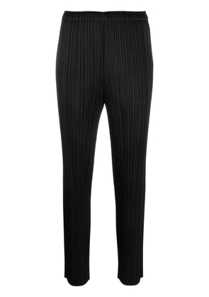 Pleats Please Issey Miyake plissé tapered-leg cropped trousers - Black