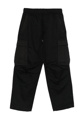Maharishi textured-pocket trousers - Black